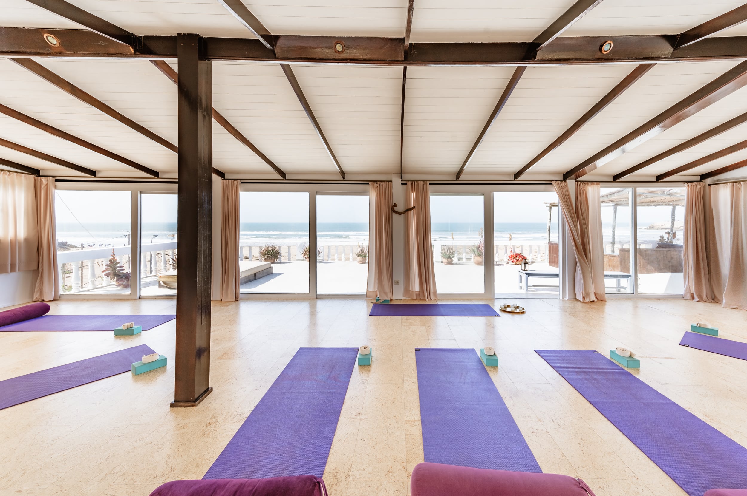 Rooftop yoga shala with mats and ocean views at Villa Mandala