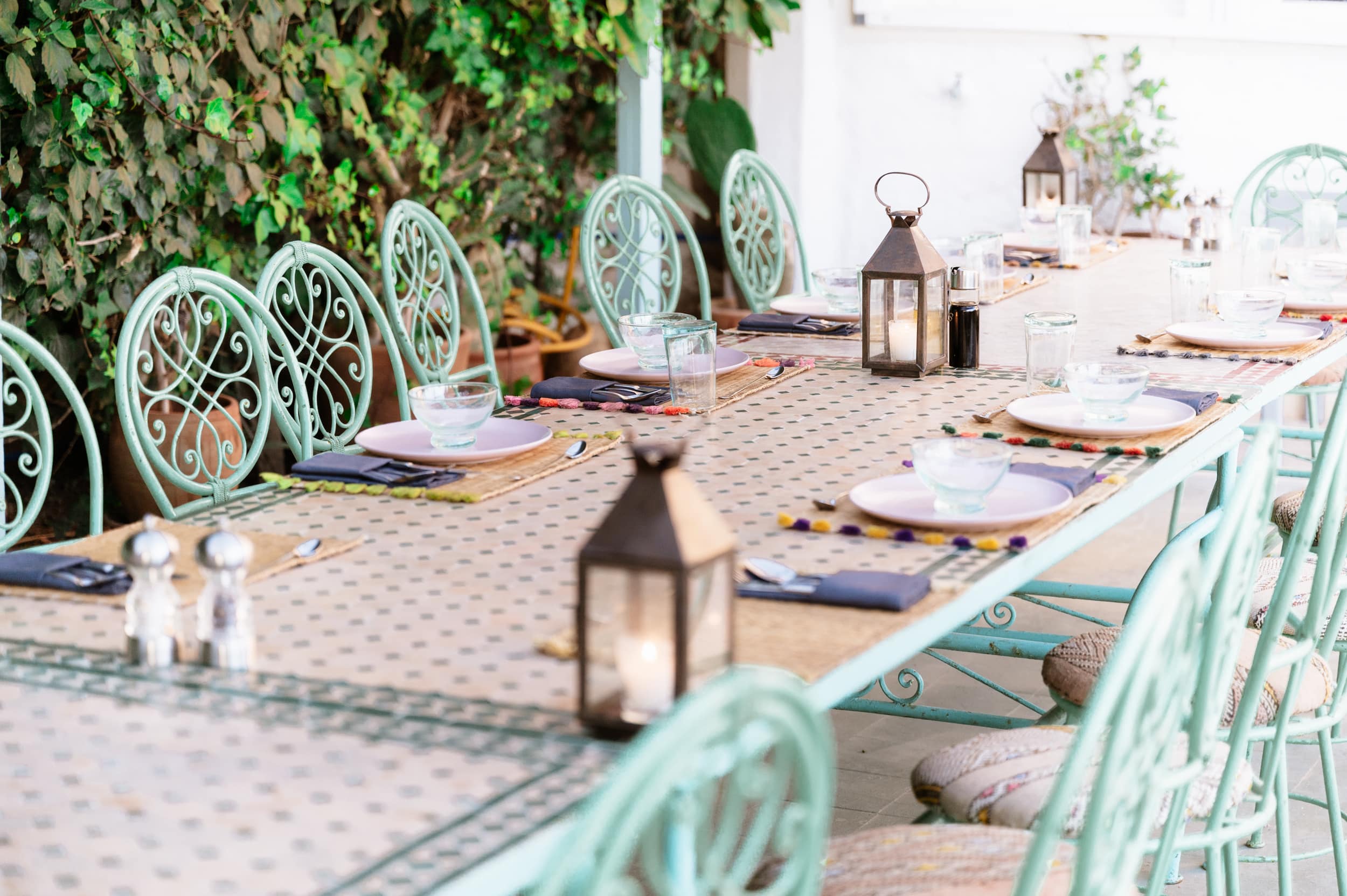 Long communal dining table set for a group at Villa Mandala